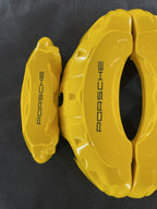 Жовті нестандартні накладки на гальмівні супорти Porsche, комплект з 4 шт.