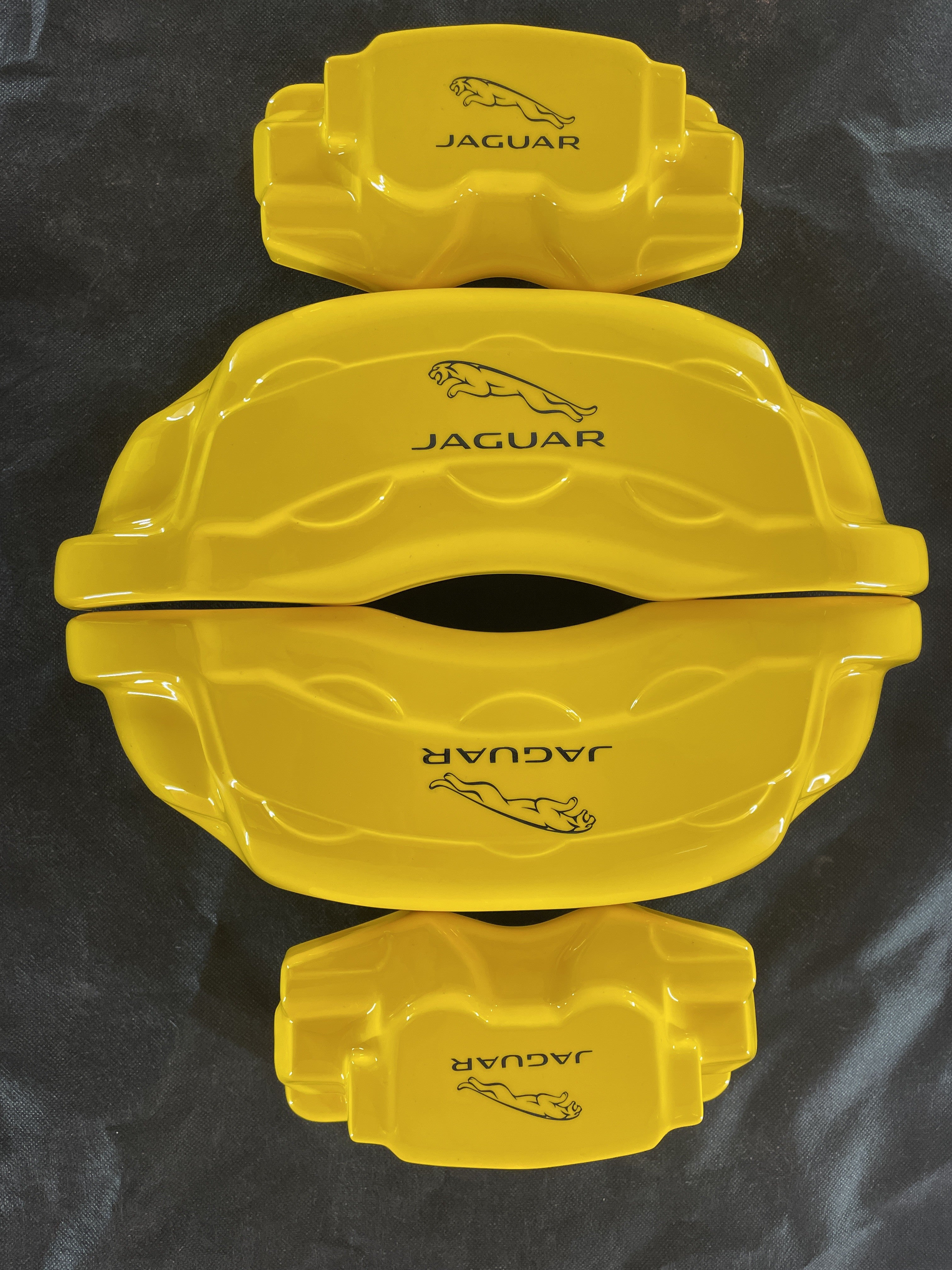 Жовті нестандартні накладки на гальмівні супорти Jaguar F-Pace 2014-2020, комплект з 4 шт.